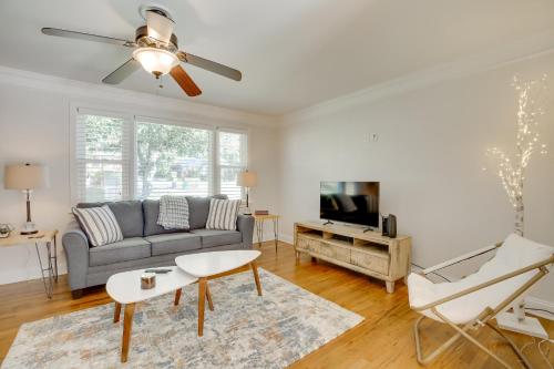 a living room with a couch and a tv at Contemporary Athens Home Less Than 2 Miles to UGA! in Athens