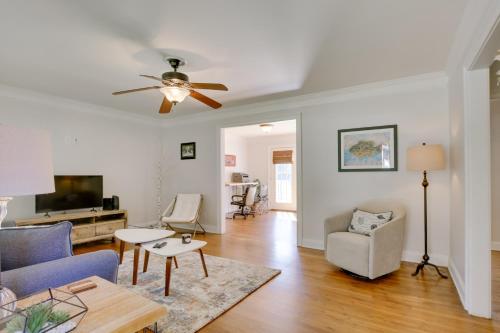 a living room with a couch and a ceiling fan at Contemporary Athens Home Less Than 2 Miles to UGA! in Athens