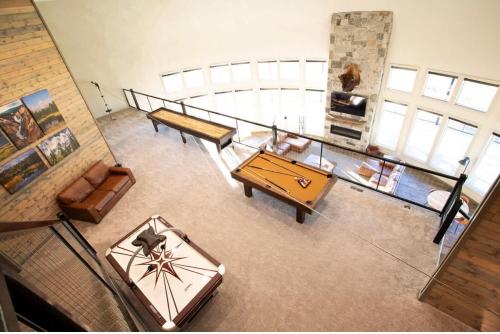 an overhead view of a living room with a table at Dual Cabin- Yellowstone Family Retreat- Sled Hill in Ashton