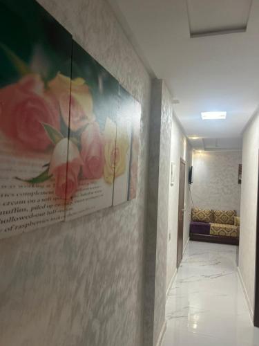 a hallway with a painting on the wall in a hospital at Near Bus Station Apartments in Tangier