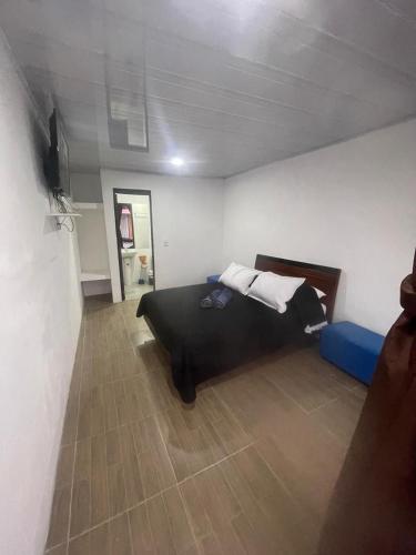 a bedroom with a bed in a room at Glamping en villa in Villa de Leyva