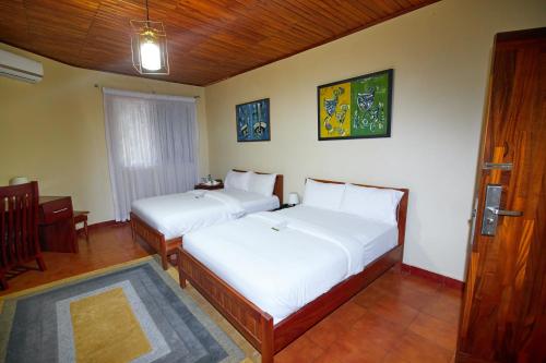 Postel nebo postele na pokoji v ubytování The Haven Boutique Hotel
