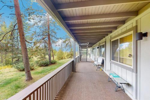 a porch of a house with benches on it at Hi Country Haus 14-5 in Winter Park