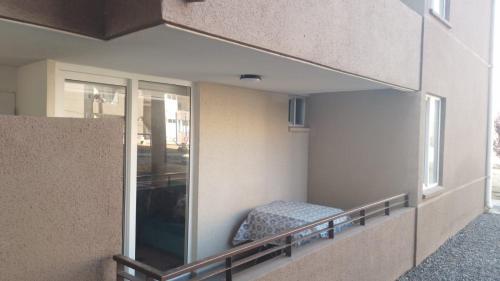 a balcony of a building with a bed in it at Arriendo Depto en Costa Azul in Cartagena