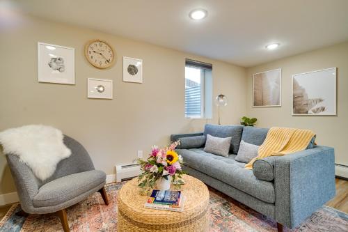 a living room with a couch and a chair and a table at Alluring Anchorage Apt - Walk to Coastal Trl! in Anchorage