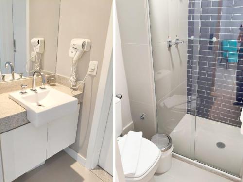 a bathroom with a toilet and a sink and a shower at Estanconfor Santos - vista mar in Santos