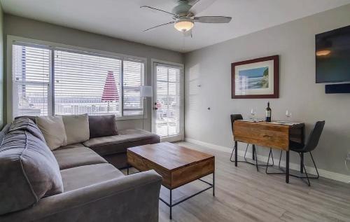 a living room with a couch and a table at One Bedroom Condo with Bay and Ocean Views San Die in San Diego