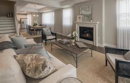 a living room with a white couch and a fireplace at Four Bedroom Condo in North Hollywood in La Paco