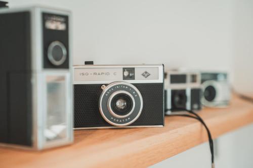 a camera is sitting on a wooden shelf at Chata Pod Skalkami in Dolný Kubín