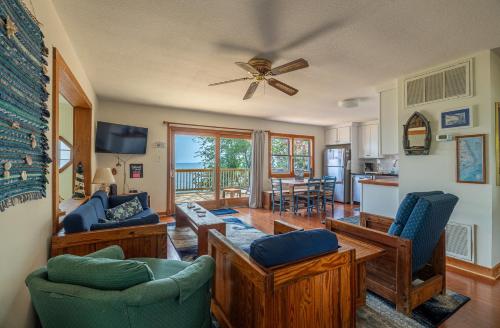 a living room with chairs and a ceiling fan at Otters Run - K1503 in Eagleton