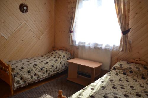 Postel nebo postele na pokoji v ubytování Rosinka