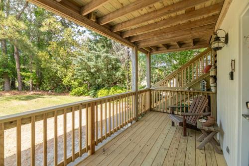 a wooden porch with a rocking chair on it at Otters Run - K1503 in Eagleton