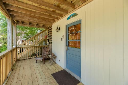 a porch with a blue door on a house at Otters Run - K1503 in Eagleton