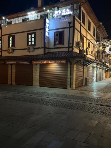 a building on a street at night at ESER PALAS OTELİ in Konya
