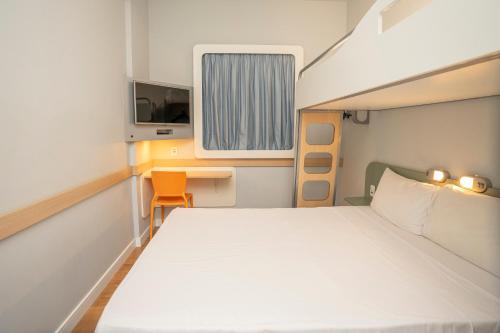 Postel nebo postele na pokoji v ubytování ibis budget Sao Bernardo do Campo