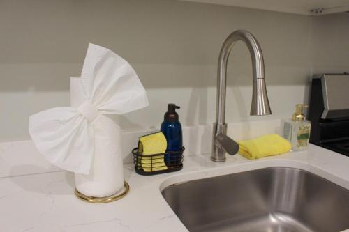 a kitchen counter with a sink and a towel dispenser at RARE 1BR Apt with Character GREAT Location! in Albany
