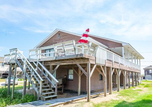 a house with a flag on top of it at Out of the Blue in Kitty Hawk