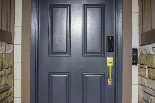 a blue door with two windows on a building at Refined 6br Moose & Bear Lodge By Sweetheart Stay in Livingston