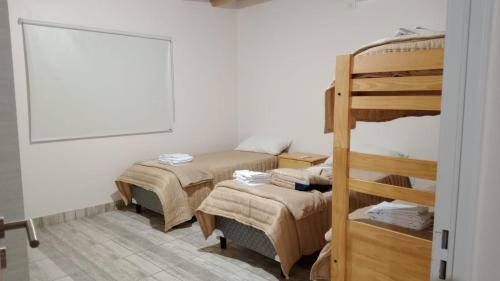 Ένα ή περισσότερα κρεβάτια σε δωμάτιο στο Cabañas Challa killa -luna de arena - fiambalá