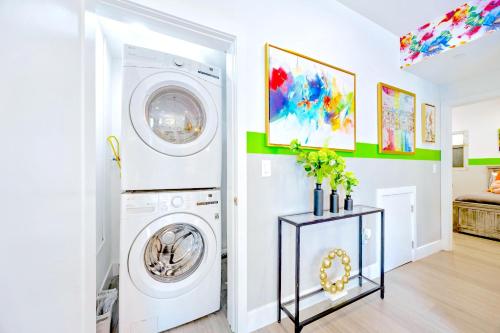 a white laundry room with a washer and dryer at B - 3BR NoHo Retreat 15m to Universal with Patio, Games & Parking - FIFA World Cup SoFi in North Hollywood