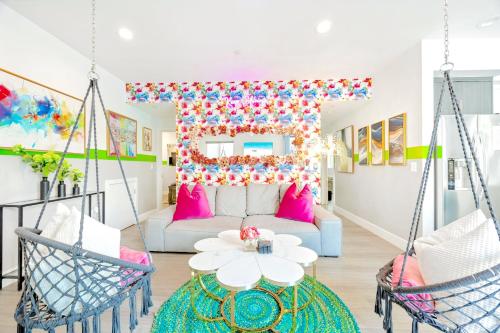 a living room with swing chairs and a couch at B - 3BR NoHo Retreat 15m to Universal with Patio, Games & Parking - FIFA World Cup SoFi in North Hollywood