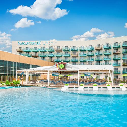 a swimming pool in front of a hotel at Margaritaville Hotel Kansas City in Kansas City