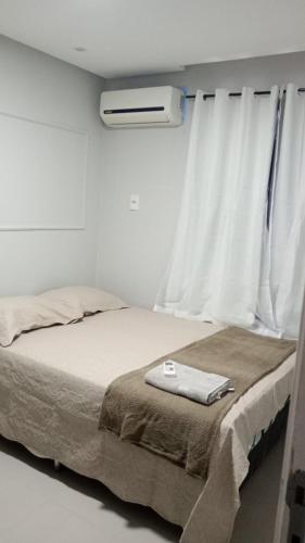 Letto o letti in una camera di Apartamento 1km da praia do Aracagir,próx da av dos holandeses