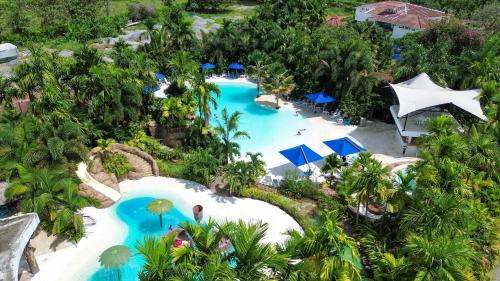 an overhead view of a pool at a resort at Hotel Playa Maui in Guamal