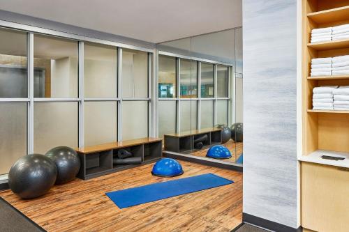 a yoga room with blue mats and mirrors at Fairfield Inn & Suites by Marriott Sheridan in Sheridan