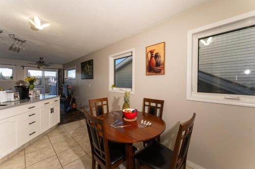 a kitchen and dining room with a table and chairs at A beautiful 2 bedroom private home in Hinton