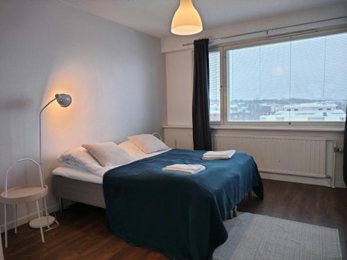 Postel nebo postele na pokoji v ubytování Central Apartment for 3 in Kuopio Center