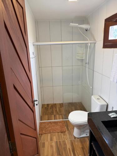 a bathroom with a toilet and a shower at Pipa Golfinhos Pousada in Pipa