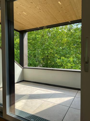 an empty balcony with a large window in a house at Landgasthof Gänsberg in Wiesloch