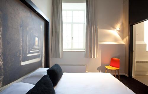 Katil atau katil-katil dalam bilik di Hotel The Lodge Vilvoorde