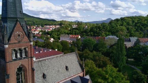 an aerial view of a church and a city at MVA House Teplice, Šanovský park in Teplice