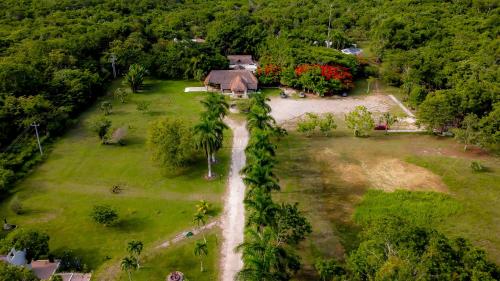 an aerial view of a house in a field at Mayan Secret Hotel Boutique in Chetumal