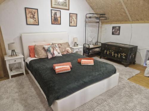 a bedroom with a bed with two pillows on it at Casa Luisa Casquinha in Vila Franca de Xira