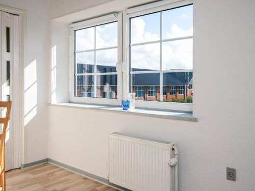 an empty room with a window and a radiator at 4 person holiday home in Ansager in Ansager