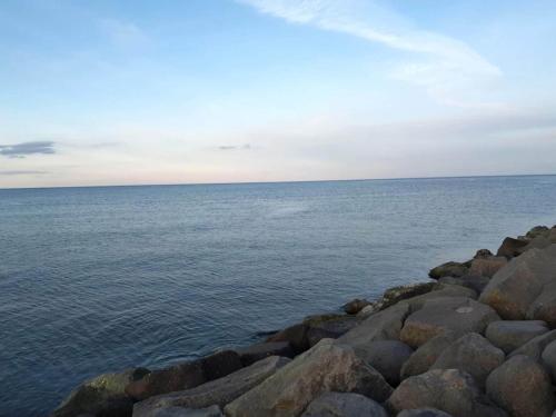 a large group of rocks on the water at 4 star holiday home in Sæby-By Traum in Sæby