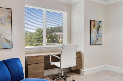a office with a desk and a chair and a window at Luxury Oak Lawn Home | Game Room, Parking, Balcony in Dallas