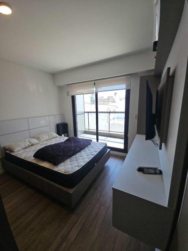 Postel nebo postele na pokoji v ubytování Alquiler Temporario Rosario 27