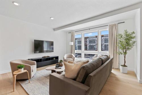 a living room with a couch and a large window at Jordanelle Express Gondola Condo 3 BR Hot Tub in Cranmer