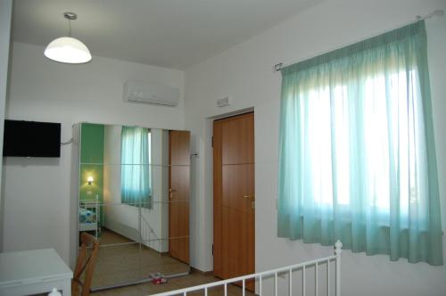 Postel nebo postele na pokoji v ubytování Country House Ciliegia Rossa