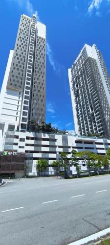 two tall buildings with a street in front of them at Peace home cybersqure 2 in Cyberjaya