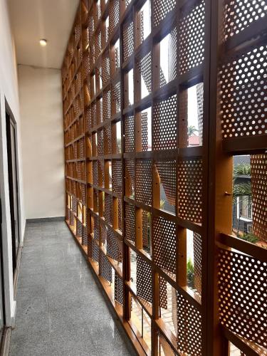 a wall of bookshelves in a library at Luxury Urban Villa 3V in Kumasi