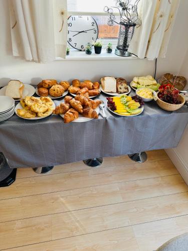 a table filled with lots of different types of food at Sonas house in Kilkenny