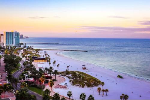 an aerial view of a beach at sunset at Mins to Beach - Studio Home- Walk to Downtown - Free Parking in Tarpon Springs