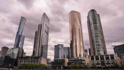a group of tall buildings in a city at Astra Apartments Southbank Prima Pearl in Melbourne