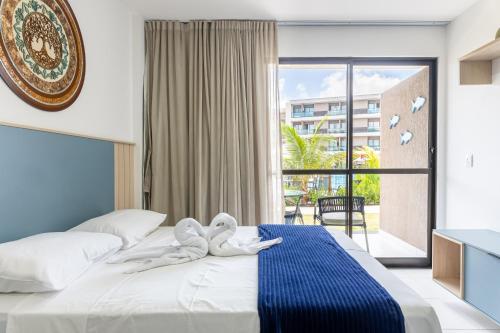 Ένα ή περισσότερα κρεβάτια σε δωμάτιο στο MALIA Beach Experience FLAT07 - Muro Alto-Porto de Galinhas