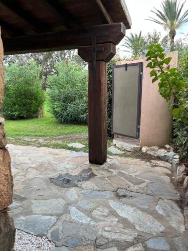 an outdoor patio with a tv sitting on the ground at San Teodoro Beach Villa 86b in San Teodoro
